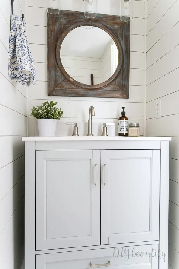 gray and white bathroom with rustic farmhouse decor