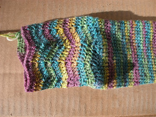 pretty teal, green, yellow, and purple ripples at the top of a sock