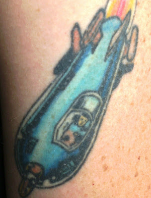 They are the Superman S, and shows the dust finish with a polish tattoo and