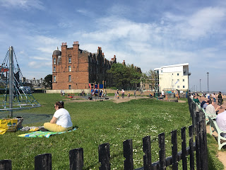 A playground with lots of kids running around.