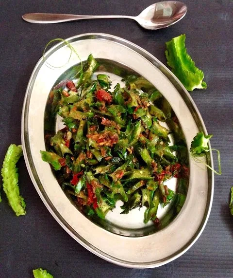 Stir-fried winged beans/kacang botol with pounded chillies, garlic, shallots, and shrimp paste, seasoned with lime, salt, and palm sugar.
