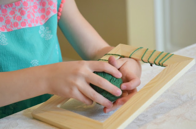 Kid made Mother's Day gift- yarn wrapped picture frames. Fun craft for preschool, kindergarten, or elementary children that makes a great gift for moms or grandmothers.