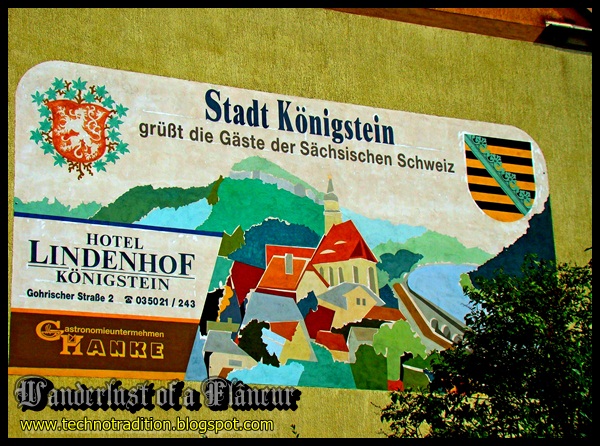 Stadt Königstein with the coat of arms of Königstein on the left and the coat of arms of Saxony on the right