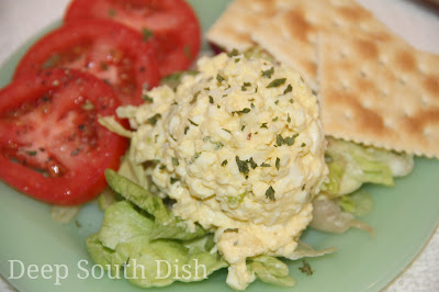 A basic egg salad made with hard boiled eggs, onion, celery, seasoned salt, pepper, Cajun seasoning, parsley, mayonnaise and mustard.