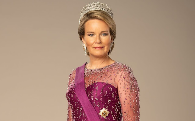 Queen Mathilde wore a red gown by Armani Prive. Queen Mathilde also wore the diamond Nine Provinces Tiara