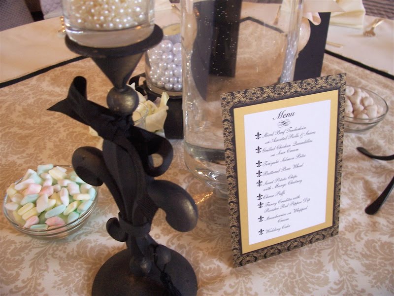 Black wrought iron, pearls gold, bows, damask.