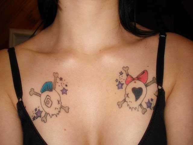 Cartoon skull and crossbones chest tattoo.