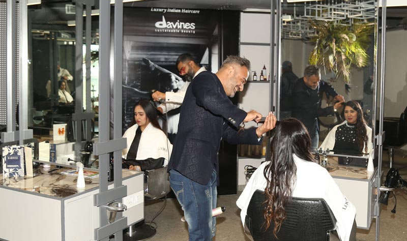 Experts demonstrating their skills of hair care during reopening of Looks Unisex Salon in Ludhiana today