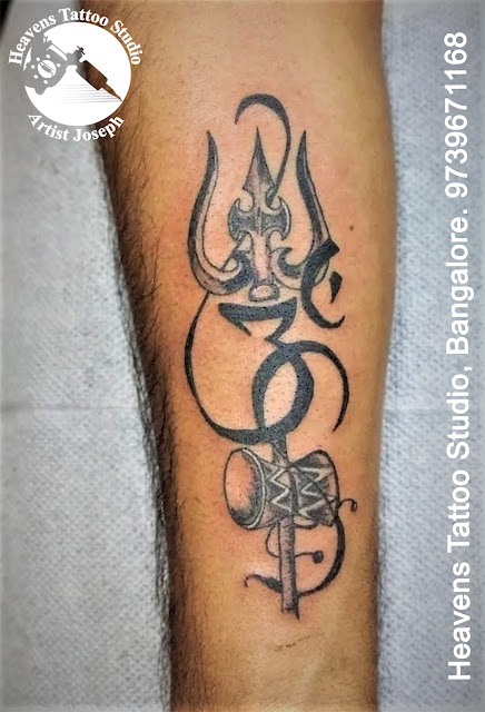 http://heavenstattoobangalore.in/om-with-trishul-tattoo-at-heavens-tattoo-studio-bangalore/