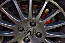 shows lug nuts on car wheel
