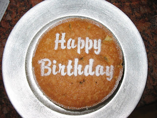 Sponge cake with stenciled Happy Birthday in Icing Sugar