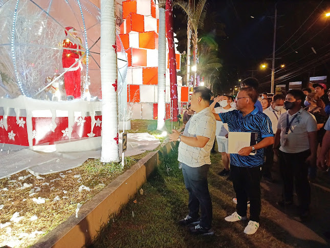 Subic Bay Metropolitan Authority (SBMA) Chairman and Administrator Rolen C. Paulino is given a brief tour of the display in front of the Subic Bay Yacht Club (SBYC) shortly after the ceremonial Christmas tree lighting ceremony to usher in the Yuletide season in the Subic Bay Freeport.