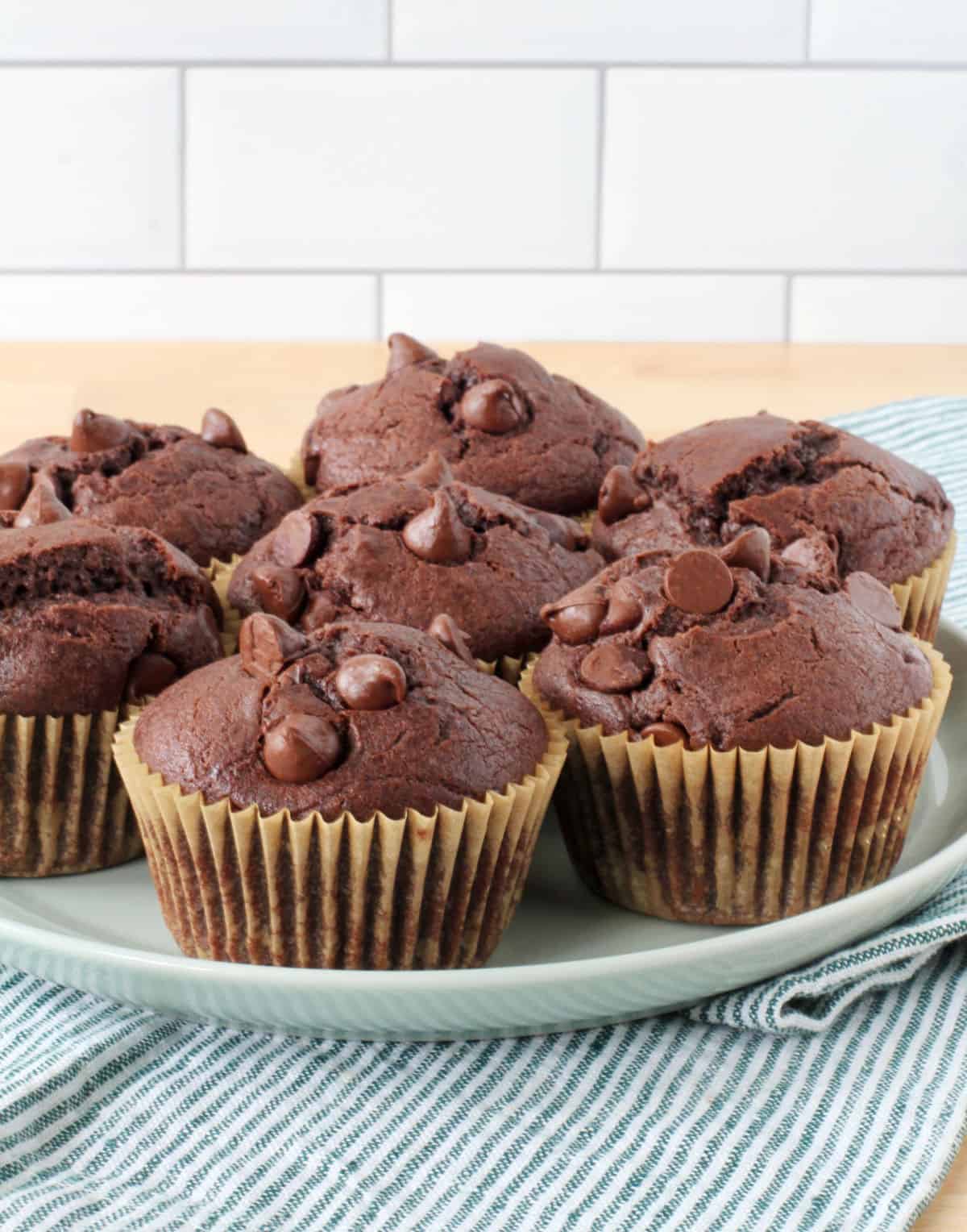 Sourdough Chocolate Muffins on a pale green plate.