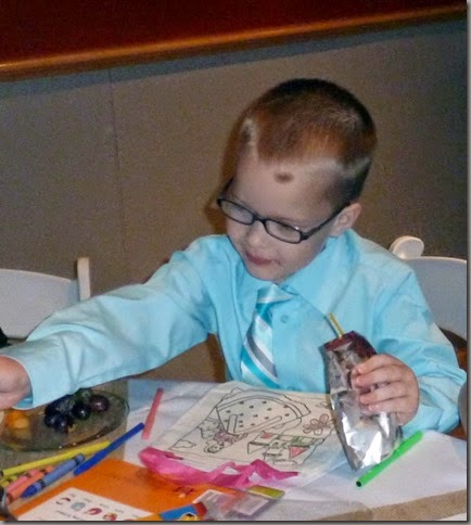 Ben at activity table set up for kids - complete with crafts and PB&J, fruit and juice packs_resize