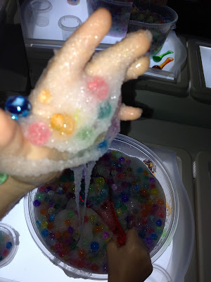 rainbow snow slime on the light table