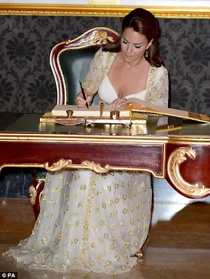 Kate Middleton shines in a white and gold Alexander McQueen gown at the Malaysian State Dinner