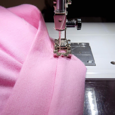 Under-stitching the neckline binding.