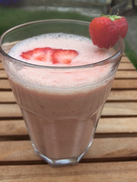 Strawberry milkshake in a tall glass