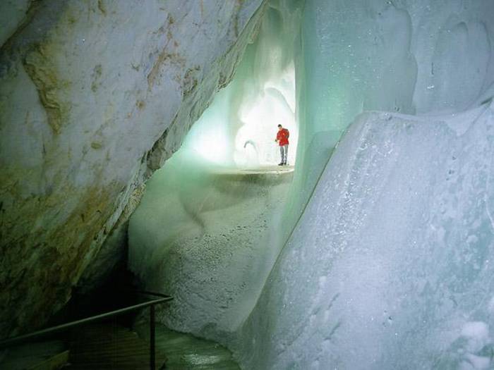 The Eisriesenwelt (German for "World of the Ice Giants") is a natural limestone ice cave located in Werfen, Austria, about 40 km south of Salzburg. The cave is inside the Hochkogel mountain in the Tennengebirge section of the Alps. It is the largest ice cave in the world, extending more than 42km and visited by about 200,000 tourists every year.