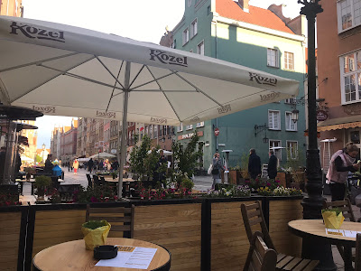 tables, chairs and umbrella on the street in poland