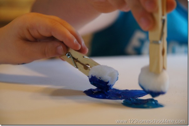 to make the blueberry shape we painted with pom pons in a clothespin handle