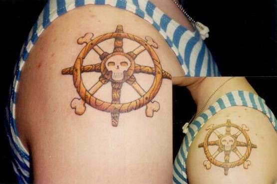 Tattoo; Color, Boat Wheels with Skull, Both Arms. Posted by Collin Kasyan