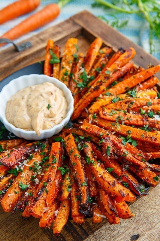 Sweet roasted carrot fries covered with crispy parmesan cheese Parmesan Roasted Carrot Fri Parmesan Roasted Carrot Fries