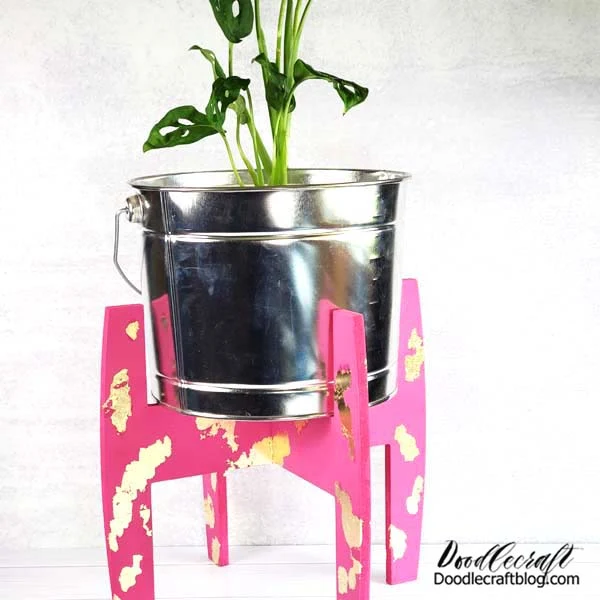 Plaid Konnectz Plant Stand Painting DIY  Paint this super chic and modern plant stand from Plaid Konnectz with Bright Magenta Apple Barrel acrylic craft paint and give it some gold leafing for shine!   I love a budget friendly and quick project!   Plaid Crafts has two awesome Konnectz kits, available at Walmart, for an awesome price!   One is a bird house and one is this modern plant stand.   They are flat pack and easy to just click together after painting.