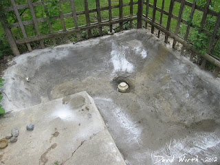 cracked concrete in pond pool wall, patch with more cement