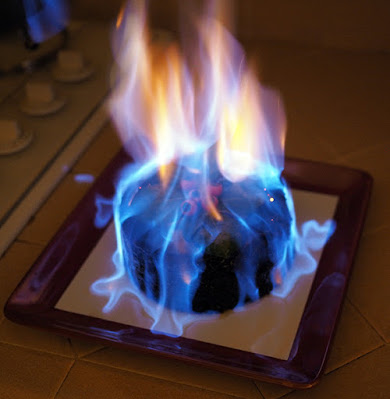 Flaming Brandy on Steamed Persimmon Pudding