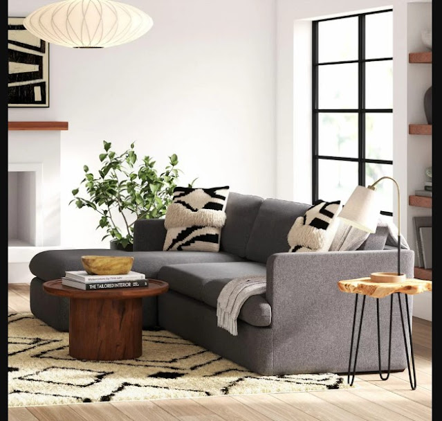 Design Interior Apartments with grey fabric loveseat sofa using track arm and padded seat cushion also white finish triangle solid wood table