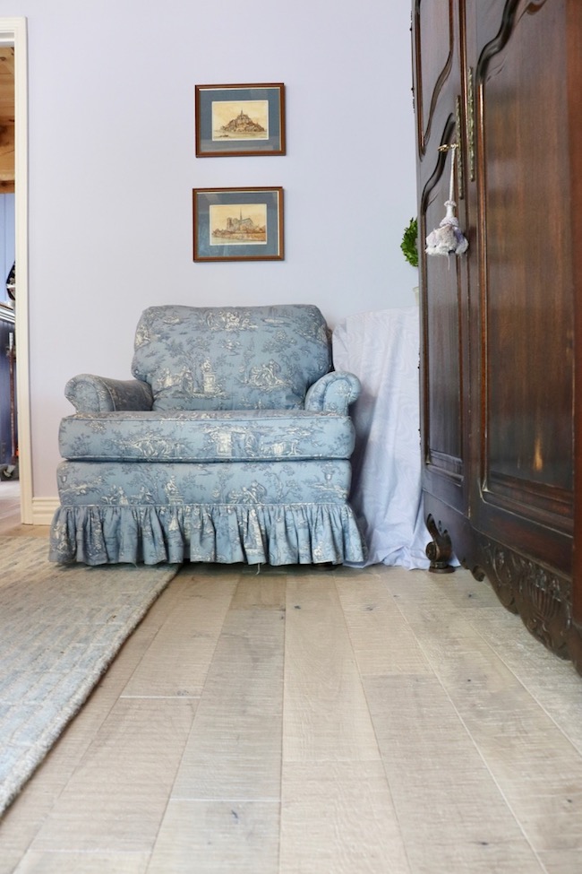 The wide planks of the French Country Hardwood Floor in the bedroom add authentic French style.