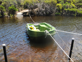 Haul the boat across the river by pulling on the rope. A taut steel cable keeps the boat on a direct path between the two sides