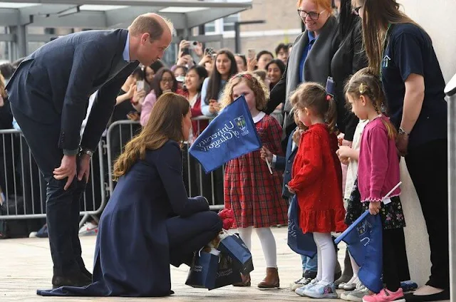 Kate Middleton wore a new Riley cornflower blue funnel-neck blouse by Cefinn. Polene Paris bag, Annoushka pearl earrings