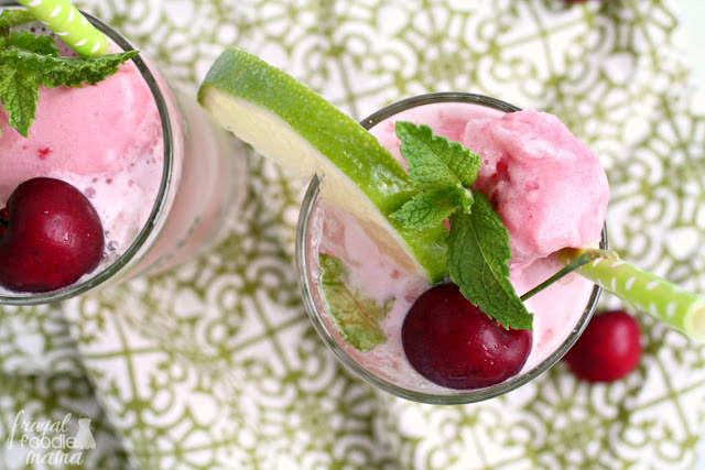 Meet your new go-to cocktail for summertime! Refreshing lime, fresh mint, & sweet cherry come together perfectly in these frosty Cherry Limeade Mojito Floats.