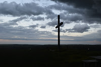 Cross under clouds - Photo by Luke Mollet on Unsplash