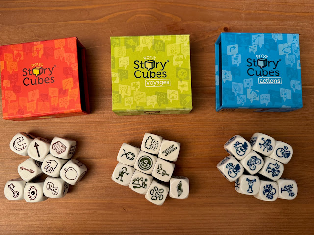 dice with pictures on them, such as apple, arrow, magnet, map