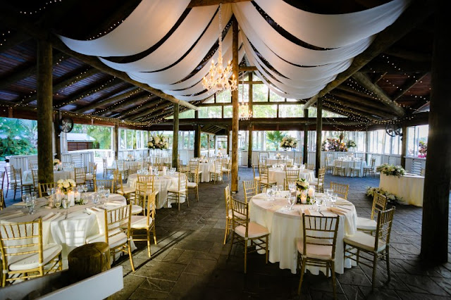 paradise cove wedding reception with white ceiling drape