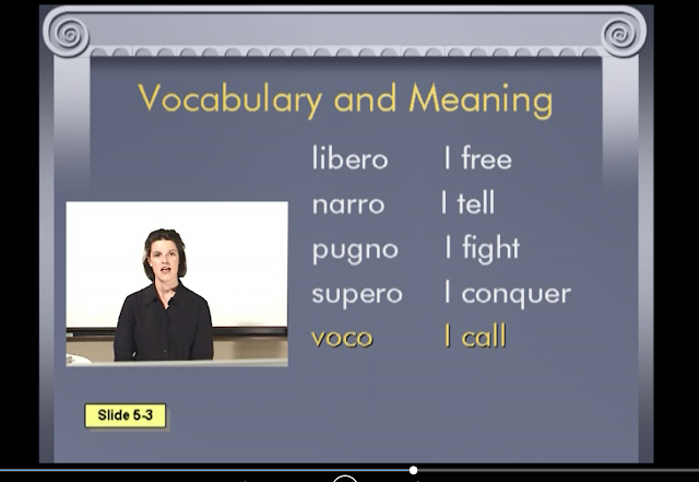 DVD screenshot of Prima Latina with vocabulary words like libero and narro