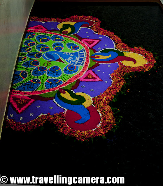 Diwali Rangoli,Art at Adobe, Rangoli is a traditional decorative folk art of India. These are decorative designs made on floors of living rooms and courtyards during Hindu festivals and are meant as sacred welcoming areas for the Hindu deities. The ancient symbols have been passed on through the ages, from each generation to the one that followed, thus keeping both the art form and the tradition alive. Rangoli and similar practices are followed in different Indian states; in Tamil Nadu, one has Kolam, Madanae in Rajasthan, Chowkpurna in Northern India, Alpana in Bengal, Aripana in Bihar, and so on. The purpose of Rangoli is decoration and it is thought to bring good luck. Teams make rangolis every year before Diwali at Adobe. However, this time the patterns were incredibly intricate and imaginative.Om is the sacred symbol of Hinduism, Buddhism, and Jainism and can often be seen in religious arts. Rangoli is no exception.The traditional rending of a new bride in a Doli. In medieval and ancient India and for a long time even in modern India, after marriage, dolis bourne on the shoulders of 4-6 men were used to transport the new bride to her husband's home. Marigold flowers (गेन्दा) are inseparable from Hindu Prayers and religios decorations. Idols of Deities are often adorned with garlands of marigold flowers and red roses.This is a clever integration of a peacock in the face of Lord Ganesh. While the peacock is the greatly revered in Hindu Scriptures, Lord Ganesh is the deity who the Hindus rely upon to take care of new entreprises. Beautiful colors and image! The peacock is also the National Bird of India.A pattern with the peacock in the center and outlined with marigold and rose petals.A Peacock is often referred to as a bird with a hundred eyes owing to the eye-like patterns in its tail feathers. The Kalash (a brass pot) is a symbol of abundance in Hinduism. It is often worshipped during the yagyas along with the deities in Arya Samaj branch of Hinduism. Full rendering of a peacock on the branch of a flowering plant with symbols of various Adobe Products in its tail. It is holding a scroll with the symbol of Adobe and the Sacred Swastik in its beak. Swastik, contrary to common knowledge, is an ancient holy symbol in Hinduism. Unfortunately, it was used by Nazis and after that the real, holy meaning seems to have been lost to the world. But in India, it is still used with a lot of respect in almost all religious ceremonies.  Lord Ganesh with his elephant head and human body. Lord Ganesh is widely worshipped along with Goddess Lakshmi (the Godess of Wealth) during diwali. Lord Ganesh, himself, is considered to be the God of New Beginnings, someone who removes hurdles. Another colorful design with the logos of various Adobe products, You can see the well know photoshop, Premiere Pro, Dreamweaver, Acrobat, InDesign etc.Diya's (earthen lamps) are used during diwali to decorate houses and businesses. They are shallow vessels made of clay or brass and have a cotton wick dipped in mustar oil.This design is more traditional with Om and a stark white color against a bright red. Two peacocks with their royal blue necks and bright green plumage. Peacocks seemed to rule the designs this year. A new age Ganesh with his vehicle, a mouse. If you look closely, the mouse if offering him an Apple that looks strikingly similar to the logo of the Software Giant of the same name. While the word Adobe has been written in a calligraphic script at the top. Cheeky!A close-up of the Kalash. This one is earthern but has been paited over with a metallic paint. Around it are typical colors of Hinduism, saffron and yellow. A close-up of the calligraphic Adobe.  Baby Ganesh, floating on a cloud, over a colorful carpet of Adobe Products. Whether this cloud is a spiritual cloud or the technical cloud, is open to interpretations. Another colorful and elaborate design with Ganesh and Swastik, The shape of a mango is another common shape in Indian arts. You'll find it used in abundance in mehndis (henna tattoos) and rangolis.Photoshop, flash, Dreamweaver, Bridge and other Adobe products around an Adobe symbol. A fancy earthen Diya full of blue rangoli color.Lord Ganesh, in his various forms, has inspired many artists. And as a result, his form has been used extensively in all kinds of arts, starting from Rangoli to paintings to sculpting. Simple, yet pretty.Adobe employees admiring one of the rangolis. Elephant, another symbol of Hinduism. This one's a tusker and is carrying Adobe on its back. Elephants are closely related to Lord Ganesh. The Rangolis are as colorful as Adobe itself. This particular Rangoli is of a dancing Lord Ganesh.Happy Diwali,  Rangoli, Art,  hinduism, Ganesh, Om, Religion, Art, Colorful