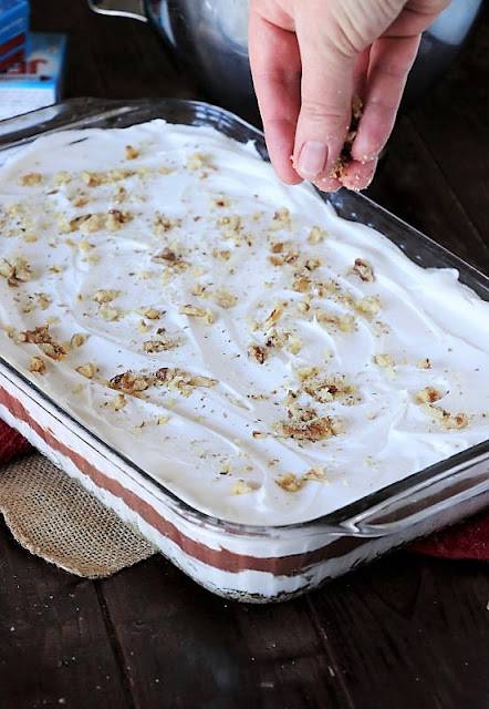 Topping Chocolate Lush Dessert with Chopped Pecans Image