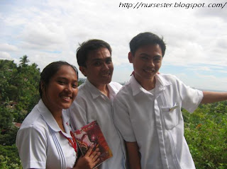 Nursing students taking a picture of the mountain view of Cebu City