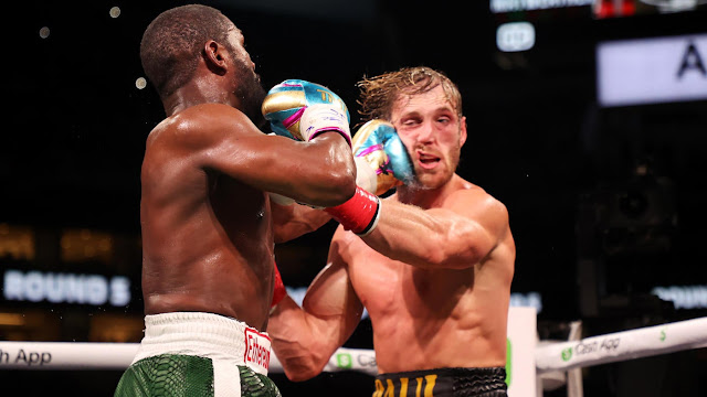 Floyd Mayweather punches Logan Paul