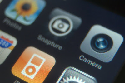 iPhone Springboard with Camera app in focus