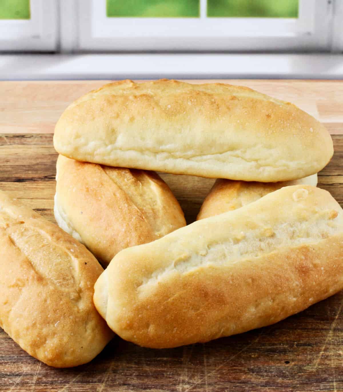 Egg Bread Hoagie Rolls on a cutting board