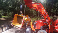 Unloading the WoodMaxx TM-86H wood chipper