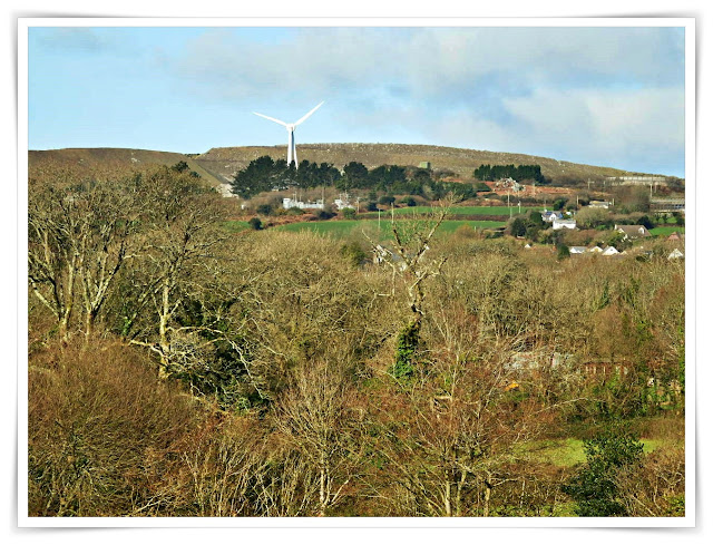 Green fields with a wind turbine on the hill, Cornwall