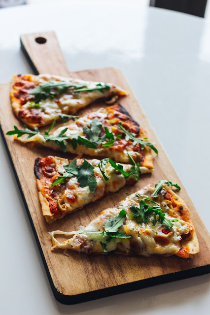 Pizza with Arugula on it