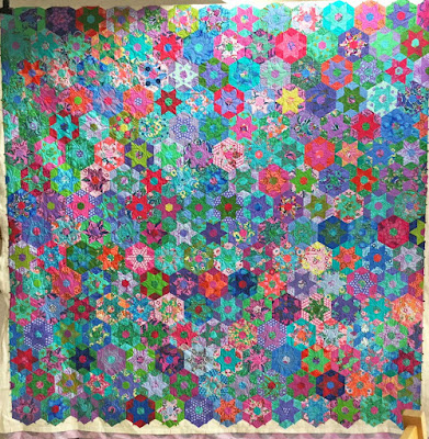 English Paper Pieced quilt made by Mercedes.   Quilted by Fabadashery Longarm Quilting