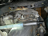 The lower cover had 3 bolts, 10 mm socket wrench. Here it just coming of.